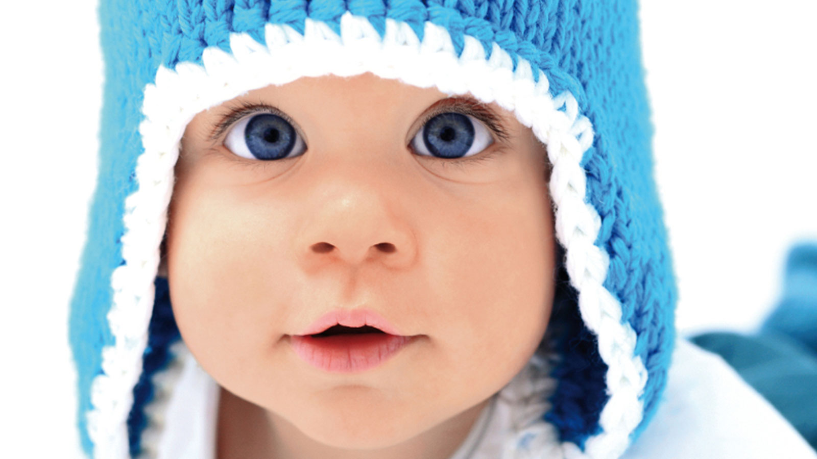 A baby with a blue cap
